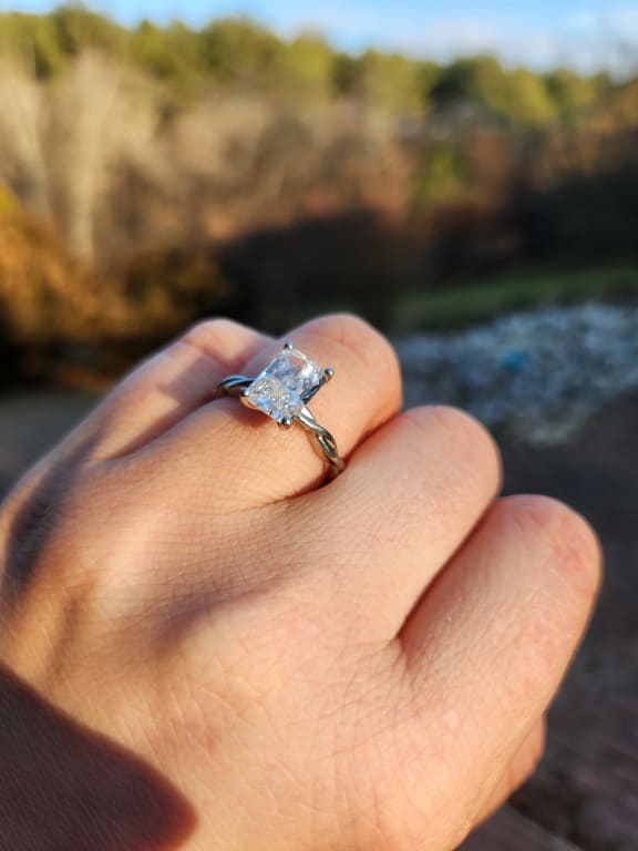 Oval diamond ring on hand