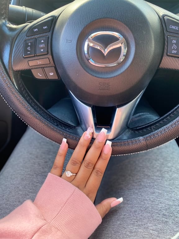 Oval diamond ring on hand