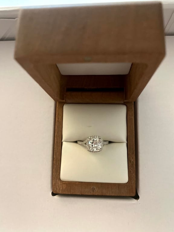 Oval diamond ring on hand