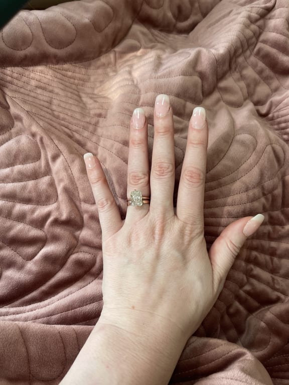 Oval diamond ring on hand