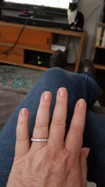 Oval diamond ring on hand