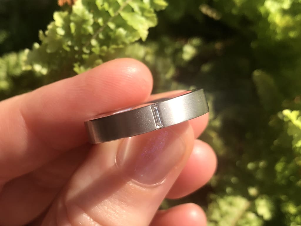 Oval diamond ring on hand