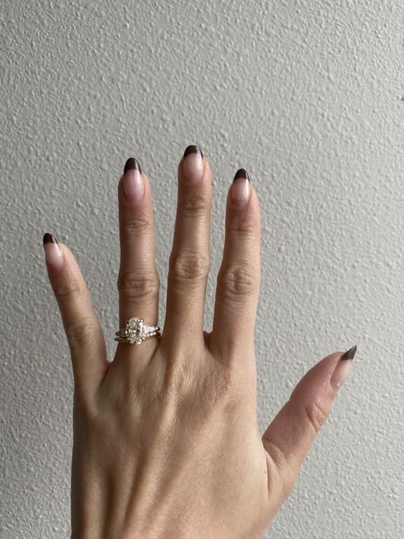 Oval diamond ring on hand