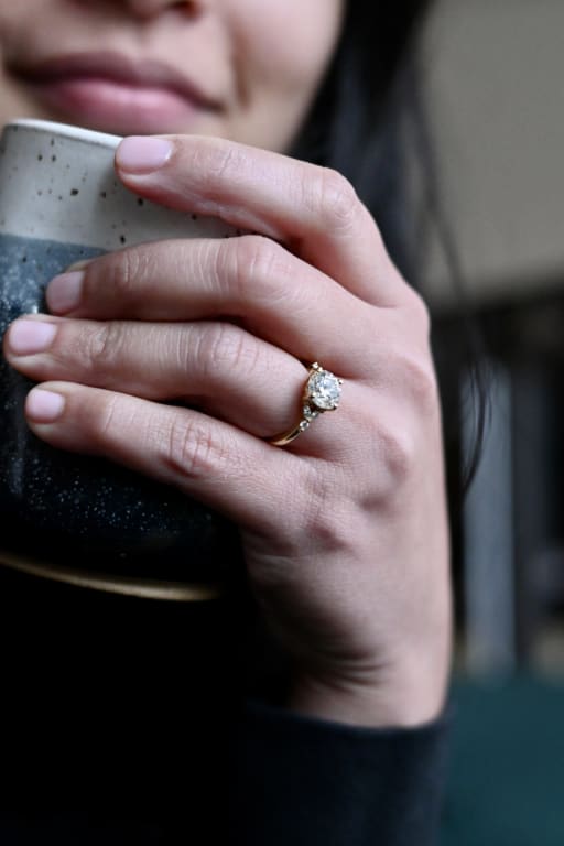 Oval diamond ring on hand