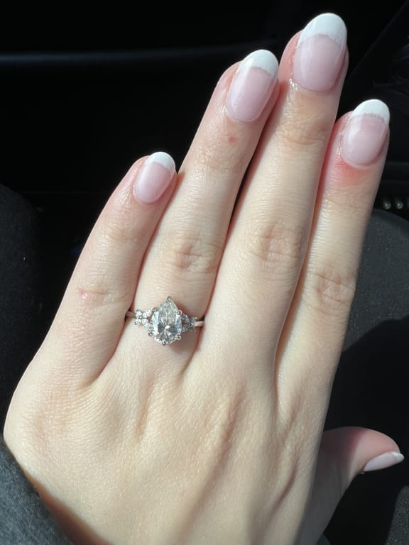 Oval diamond ring on hand