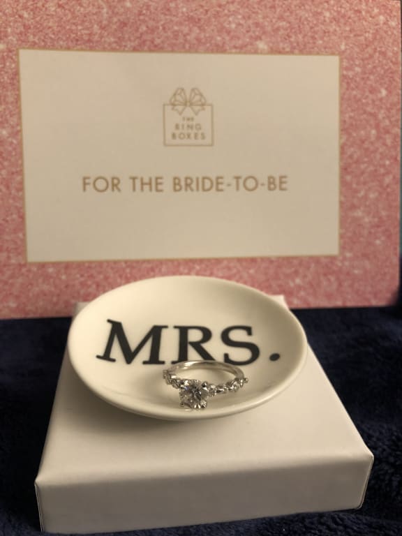 Oval diamond ring on hand