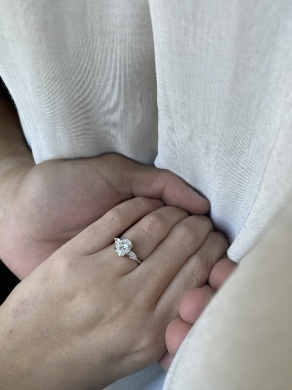Oval diamond ring on hand