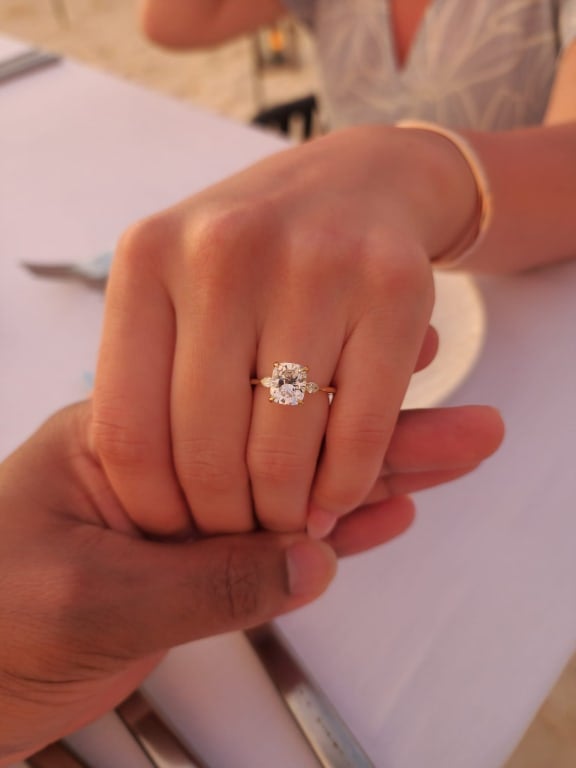 Oval diamond ring on hand