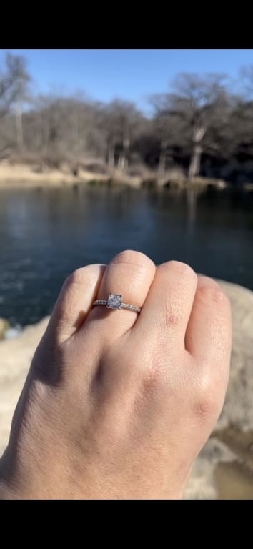 Oval diamond ring on hand