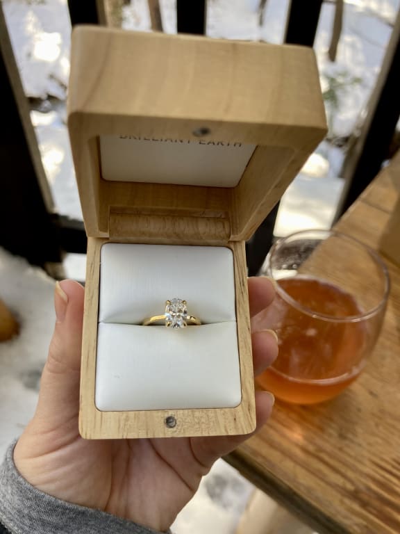 Oval diamond ring on hand