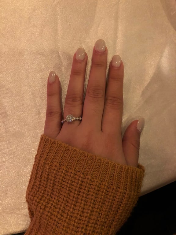 Oval diamond ring on hand