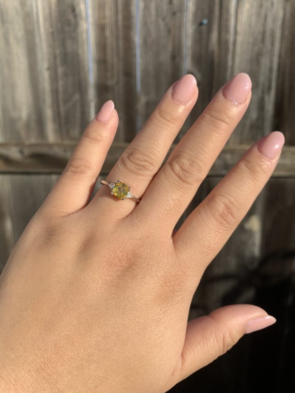 Oval diamond ring on hand