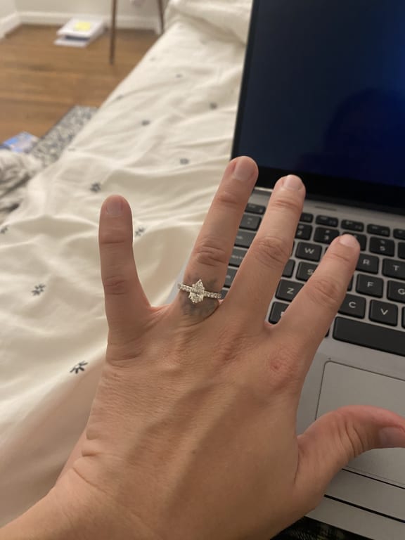 Oval diamond ring on hand