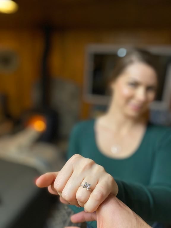 Oval diamond ring on hand