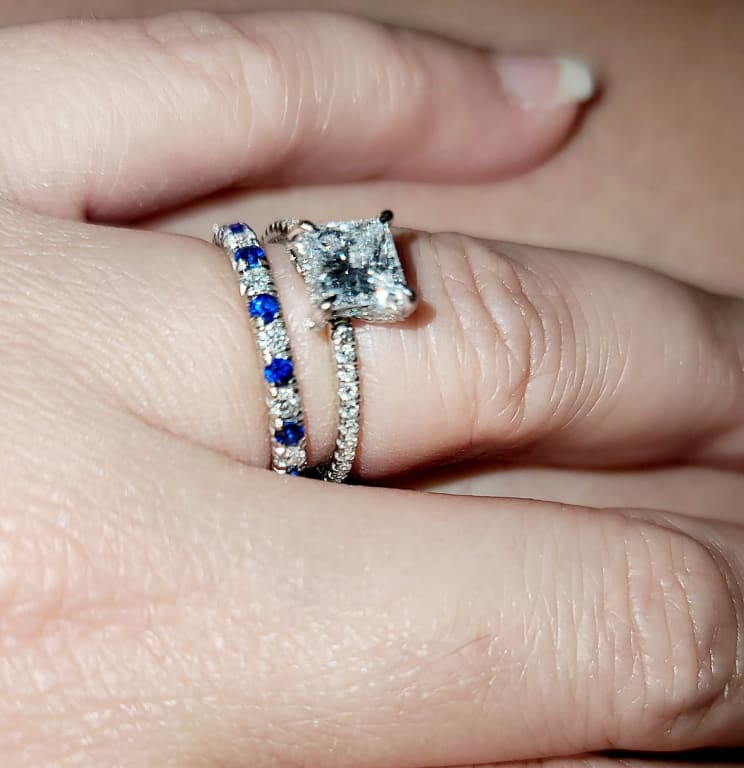 Oval diamond ring on hand