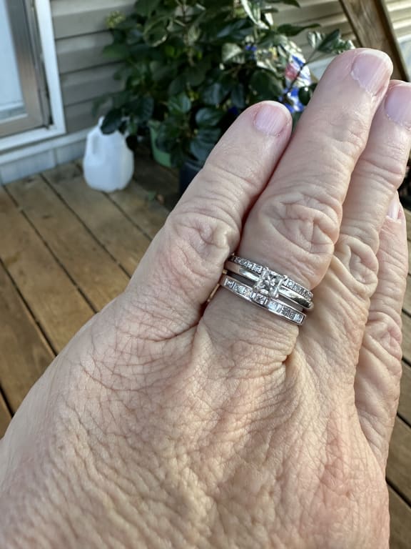 Oval diamond ring on hand