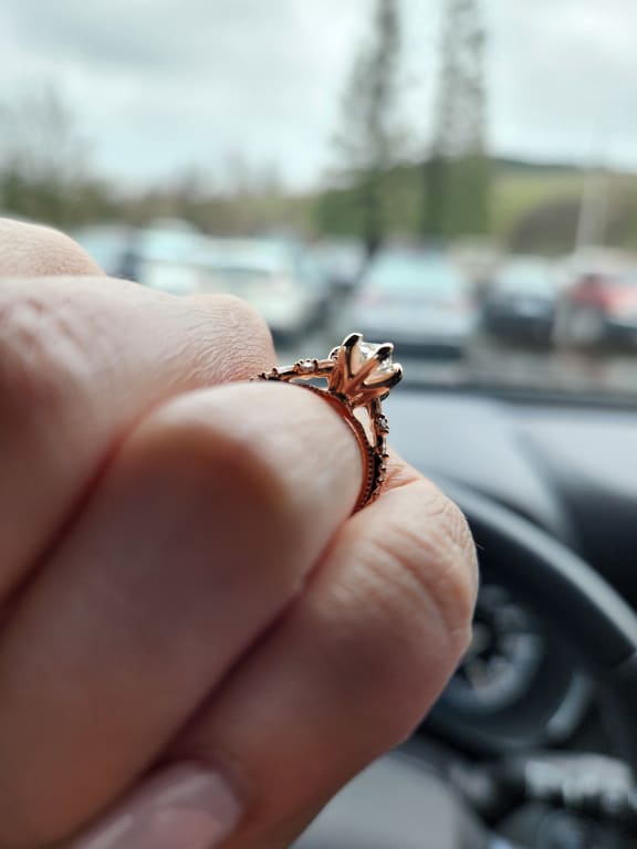 Oval diamond ring on hand