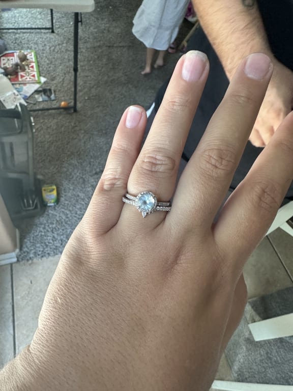 Oval diamond ring on hand