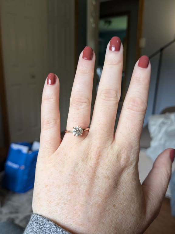 Oval diamond ring on hand