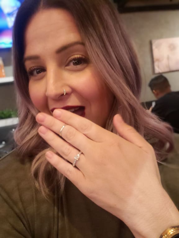 Oval diamond ring on hand