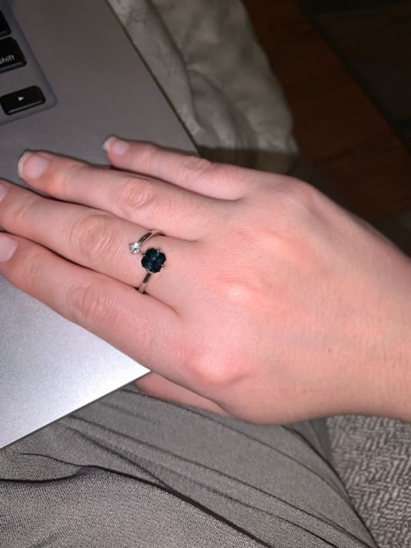 Oval diamond ring on hand