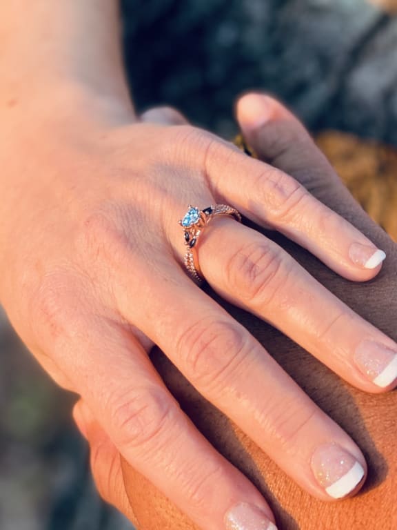 Oval diamond ring on hand