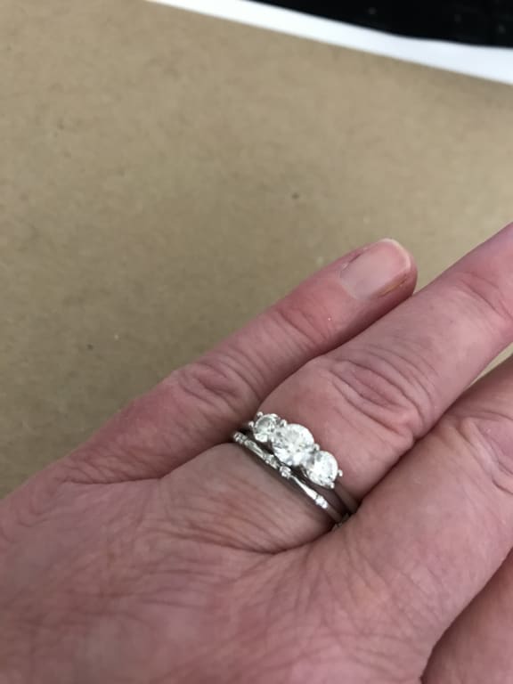 Oval diamond ring on hand