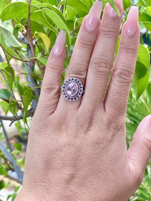Oval diamond ring on hand