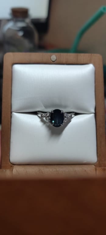 Oval diamond ring on hand