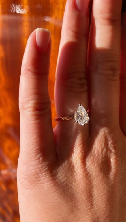 Oval diamond ring on hand