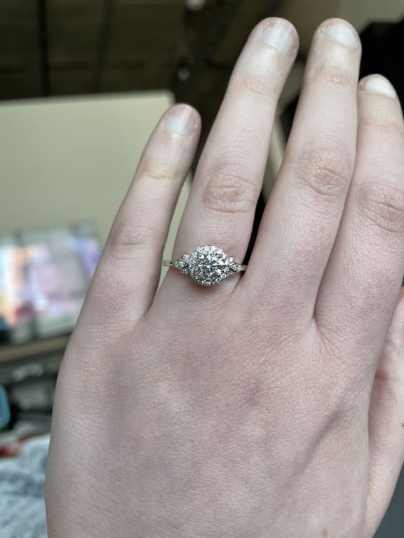Oval diamond ring on hand