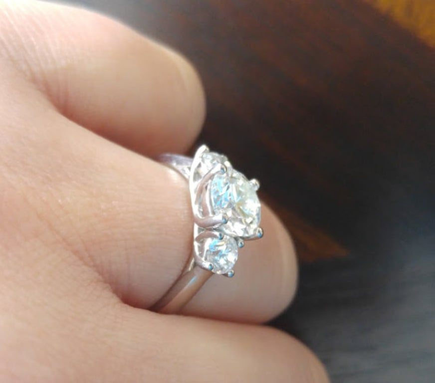 Oval diamond ring on hand