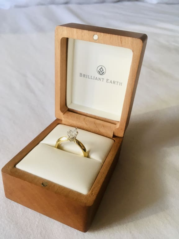 Oval diamond ring on hand