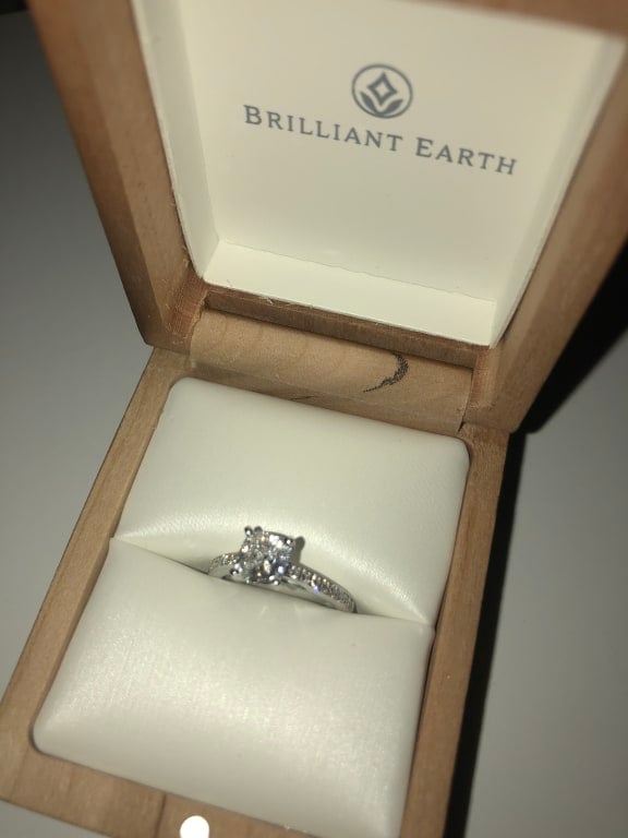 Oval diamond ring on hand