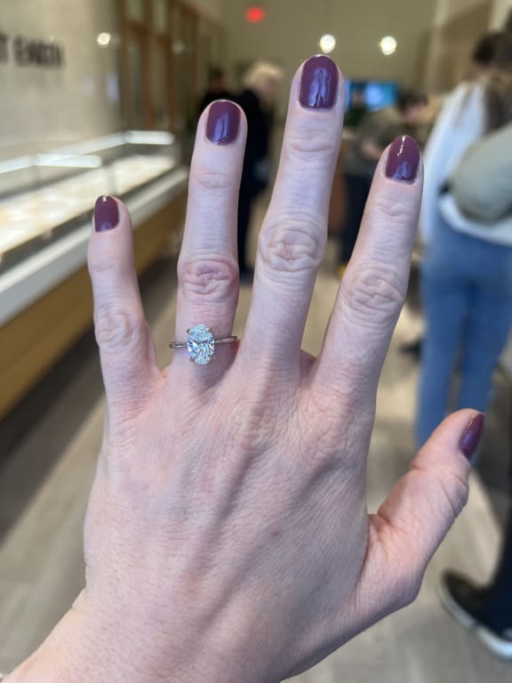 Oval diamond ring on hand