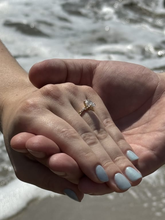 Oval diamond ring on hand