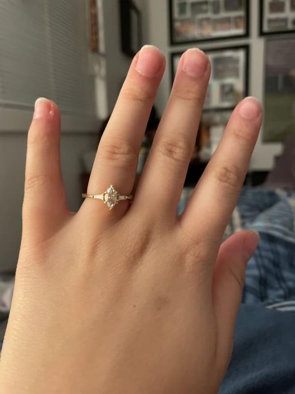 Oval diamond ring on hand