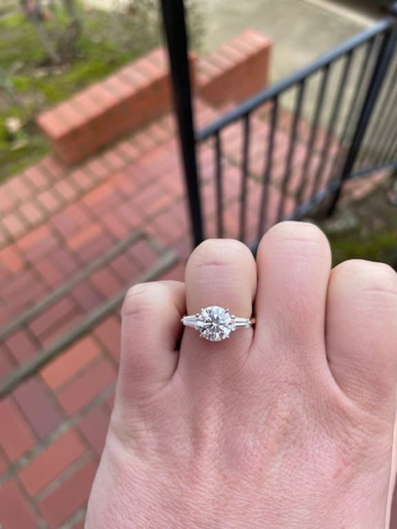 Oval diamond ring on hand