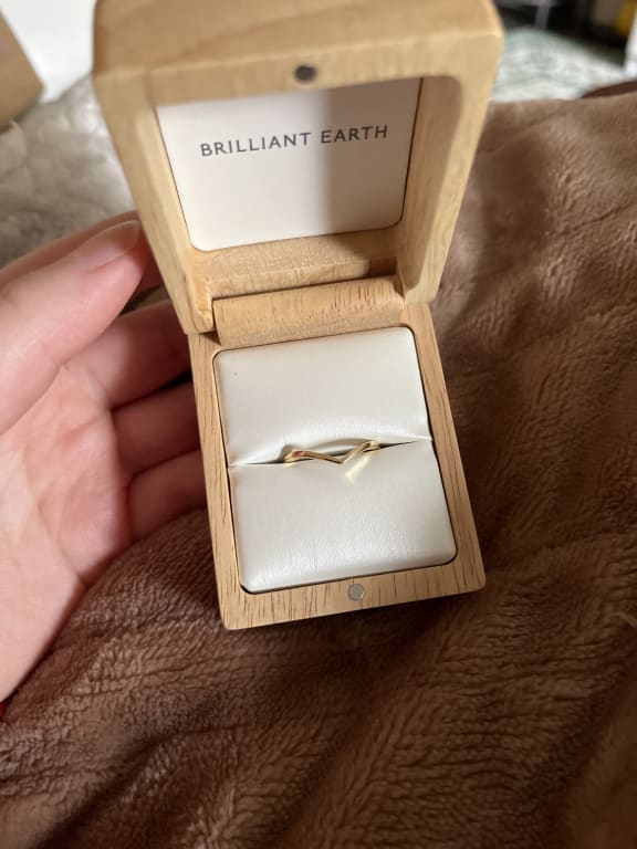 Oval diamond ring on hand
