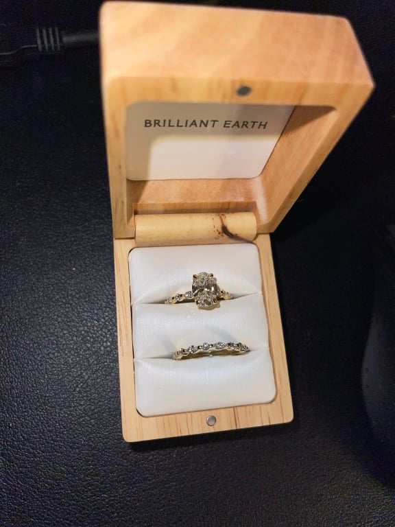 Oval diamond ring on hand