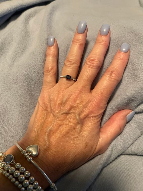 Oval diamond ring on hand