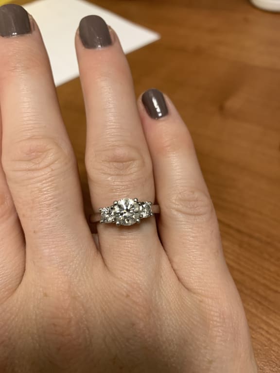 Oval diamond ring on hand