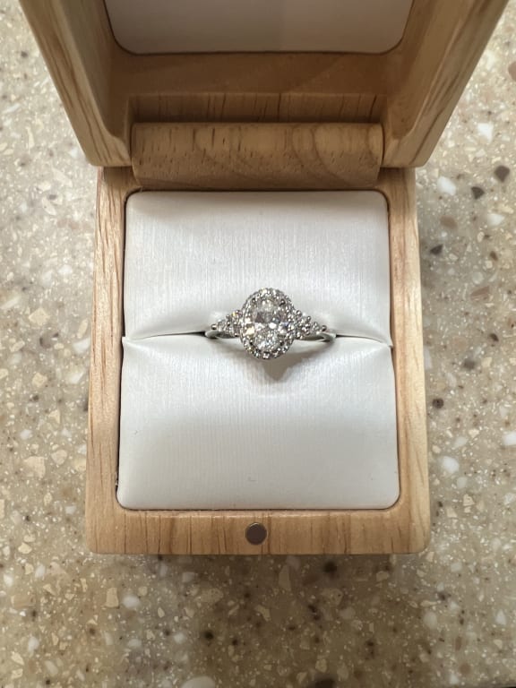 Oval diamond ring on hand