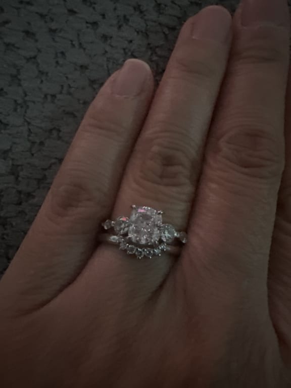 Oval diamond ring on hand