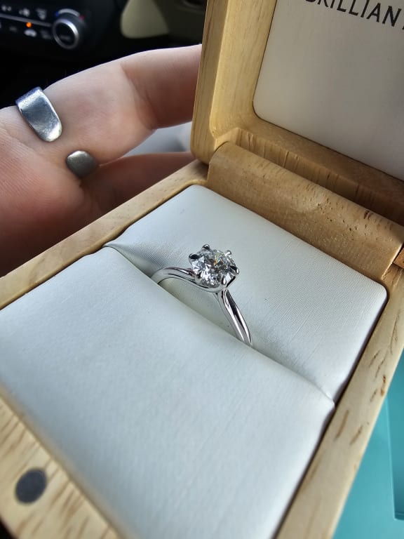 Oval diamond ring on hand