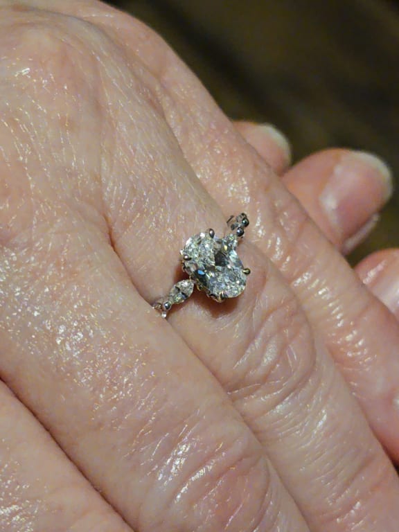 Oval diamond ring on hand