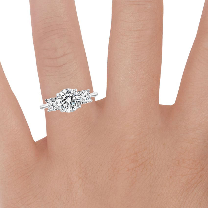Platinum Luxe Selene Three Stone Diamond Ring (2/3 ct. tw.), large zoomed in top view on a hand