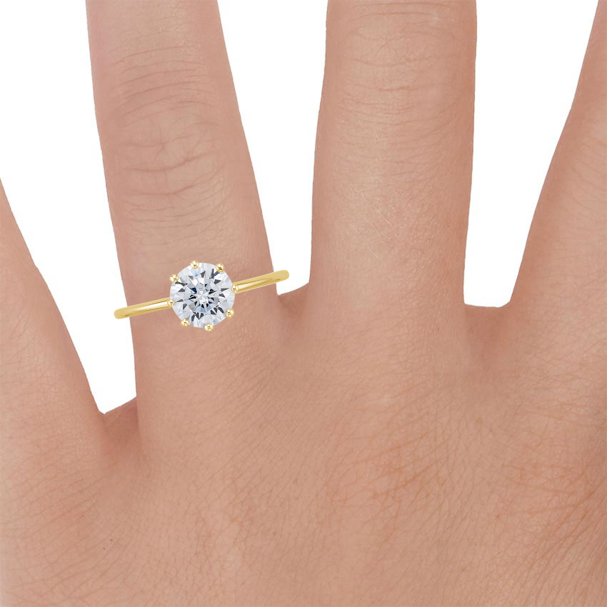 18K Yellow Gold Eight Prong Petite Elodie Ring, large zoomed in top view on a hand