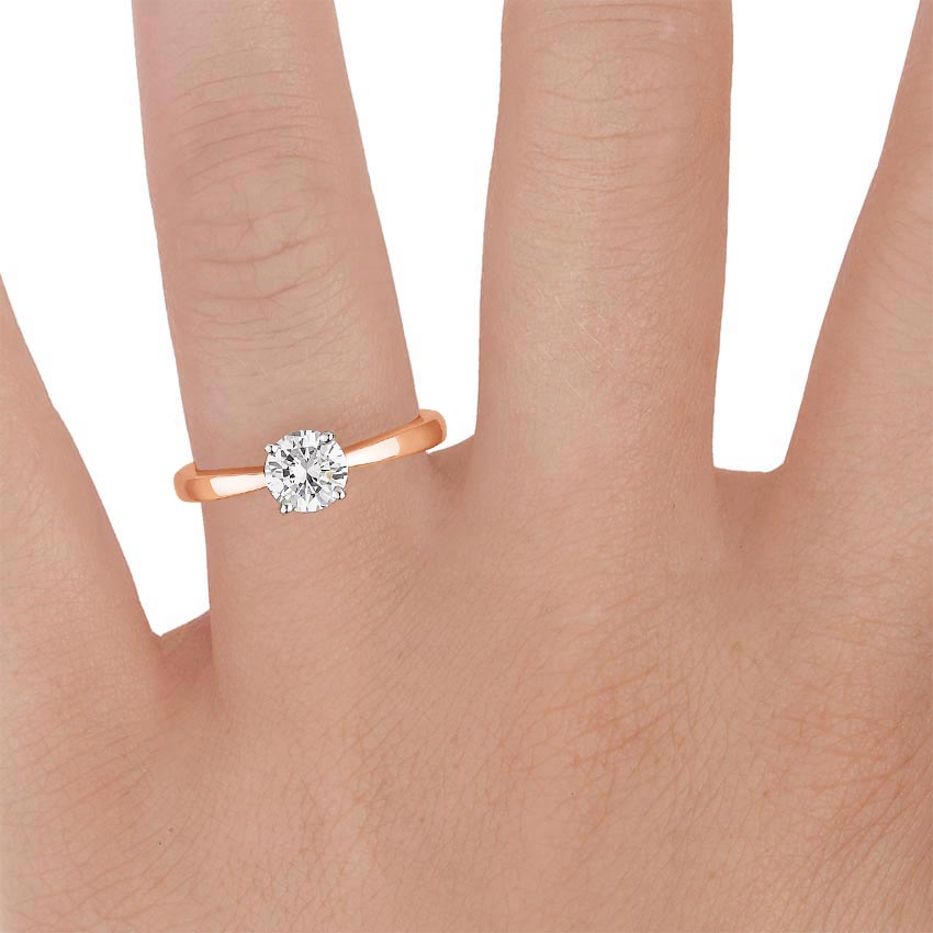 14K Rose Gold Petite Taper Solitaire Ring, large zoomed in top view on a hand