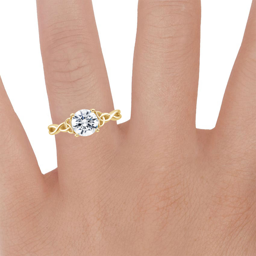 18K Yellow Gold Celtic Love Knot Ring, large zoomed in top view on a hand